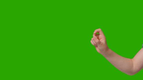 Close-Up-Of-Child-Making-Online-Pinching-Gesture-Against-Green-Screen